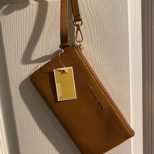 Brand new Michael Kors medium wristlet, Jet Set, Acorn color
